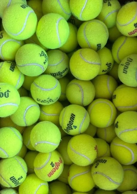 A mix of well-loved upcycled tennis balls collected from courts and clubs